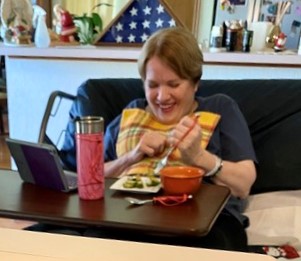 Person living with ALS eating