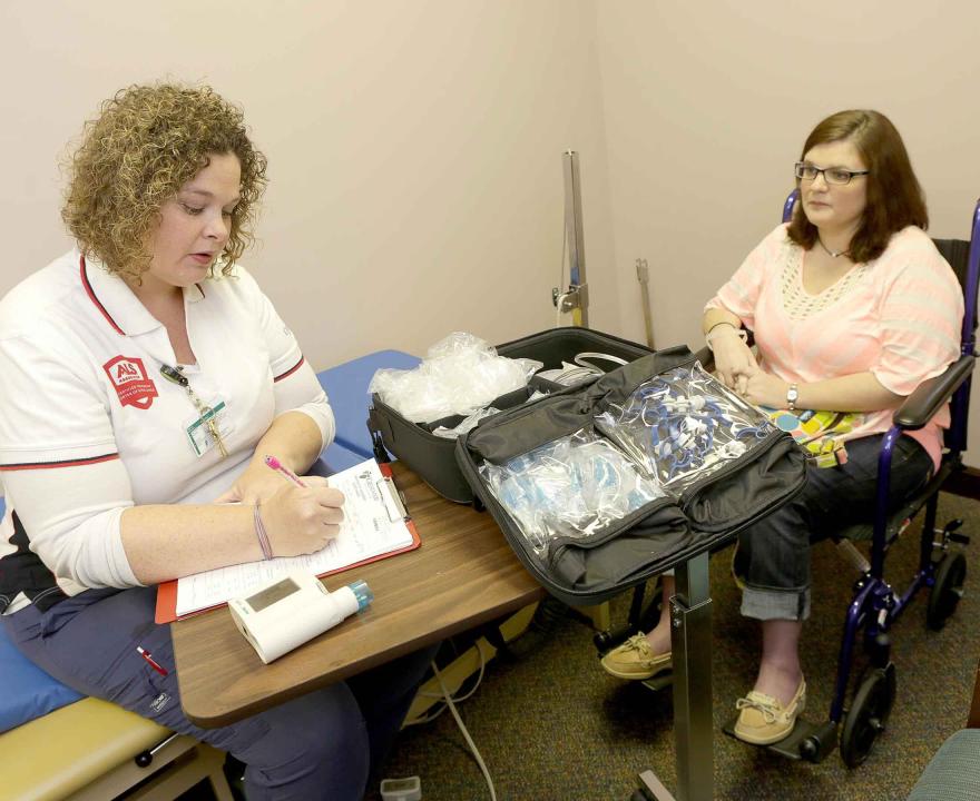 Young woman meeting with a nurse at an ALS Certified Treatment Center
