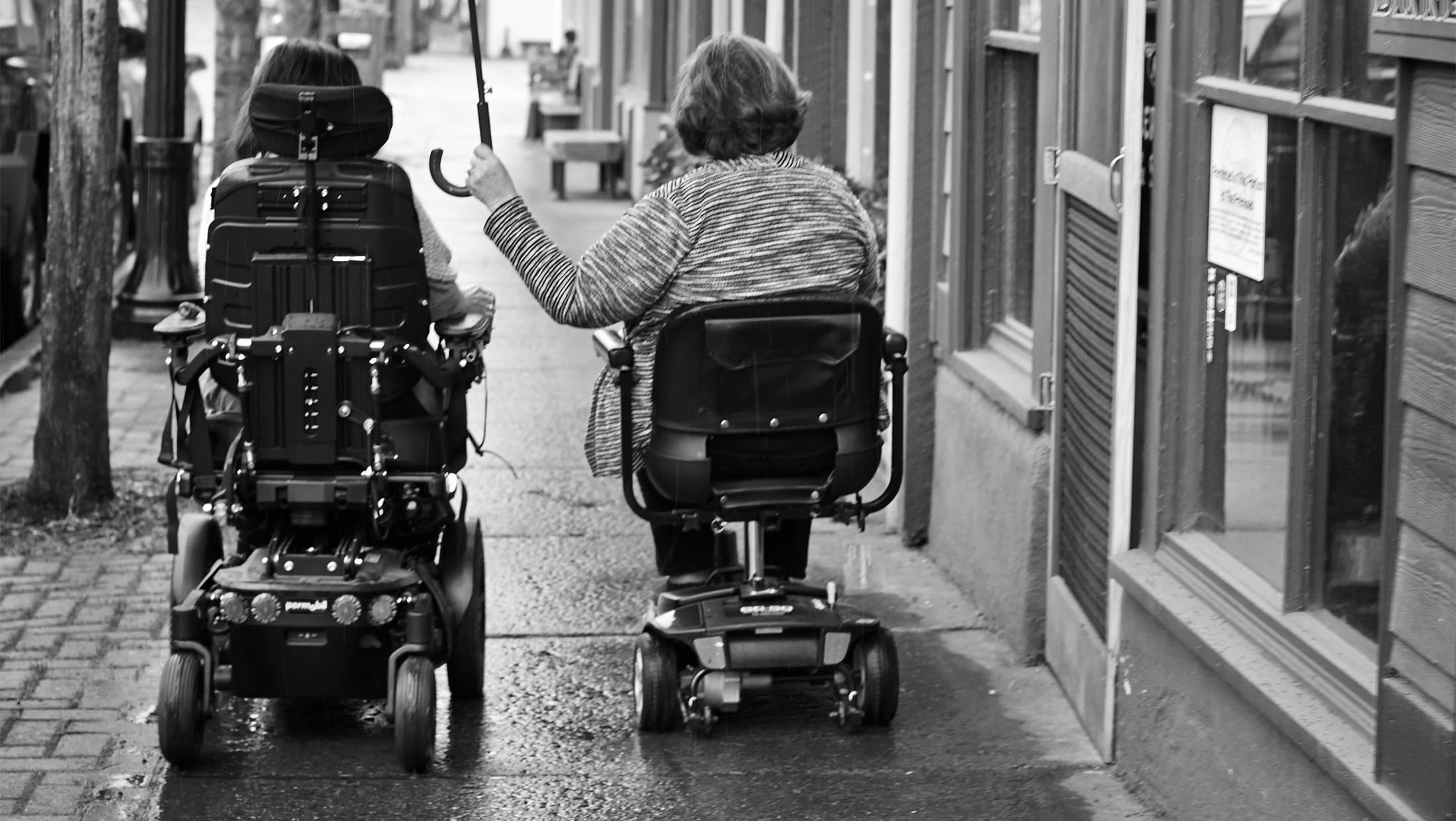 two women in wheelchairs
