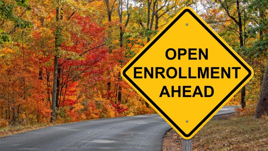 Open enrollment ahead road sign