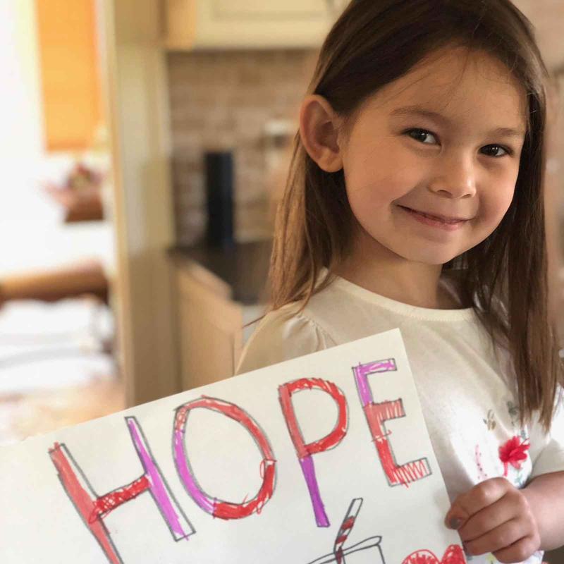 Little Girl with HOPE sign